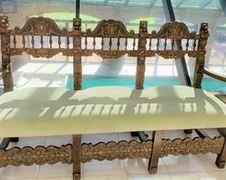 From a three piece set. Carved settee with two chairs