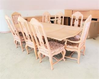 Light wood dining set . Trestle table with 8 chairs.