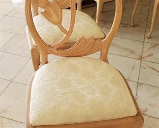 Set of 12 Carved chairs with floral motif