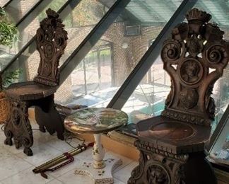 Pair of carved hall chairs with Mozart crests