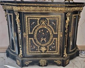 JUST ADDED. Impressive marble top large pier cabinet- Napoleon III style. Attributed to Linke. Black cabinet with Pietra Dura mounted plaques, curved glass door sides. Size 64.5” wide, 45” high