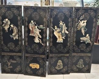 JUST ADDED. Set of four vintage Chinese black lacquered plaques with hardstone figures and animals. 36”x 12”.