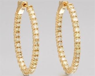 A Pair of Diamond Hoop Earrings 
