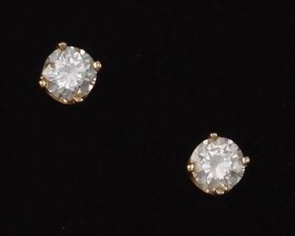 A Pair of Diamond Stud Earrings 
