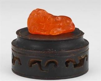 Japanese Signed Amber Recumbent Lion Netsuke, on Wood Stand 