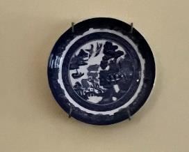 Decorative blue willow with wall plates, part of a much larger set 