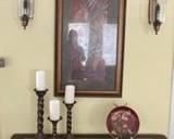 Side table, sconces, candleholders with candles, decorative plate with stand