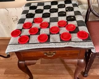 Cloth checker/tic tac toe set .And the table is for sale too. 