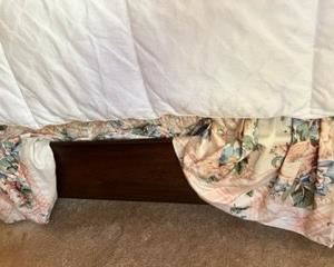 Wood frame on sleigh bed.