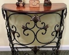 Beautiful half oval side table with intricate wrought iron black and copper tones detail 27-1/2"W x 15"D x 28"H, and all decorative accents also for sale