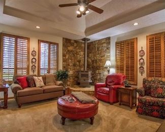 Leather chair and matching ottoman, custom upholstered Lazy Boy swivel rocker, s brown sofas, tables, etc. Just a view of the room before everything starts to sell!