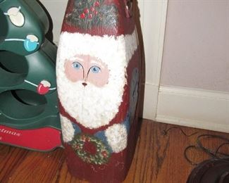 Large antique wood buoy turned into a Santa