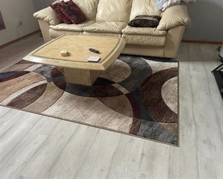 . . . a matching area rug and marble type coffee table