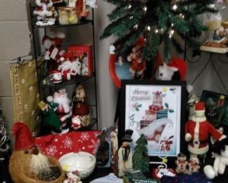 Lighted holiday palm tree, various Christmas decorative items.