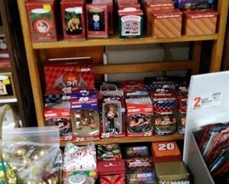 Various Hallmark and Tony Stewart tree ornaments.