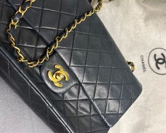 CHANEL 2.55 noire quilted  Black Quilted Medium Classic Double Flap Gold Hardware, 2009.  This bag resells for $8-9000.  Our price is $4000.