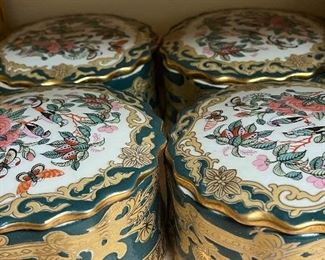 Set of four porcelain trinket boxes