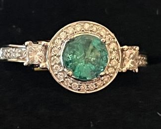 1carat emerald surrounded by .50  white diamonds…$2800