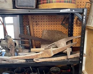 Assortment of rock picks, shovel head, need handles