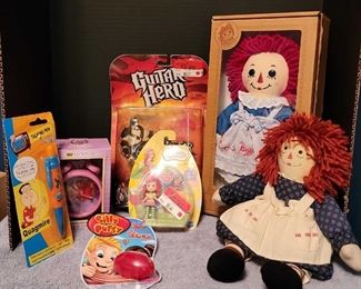 2 Raggedy Ann, Strawberry Shortcake, Guitar Hero, Sleeping Beauty Alarm Clock, Quagmire Talking Pen