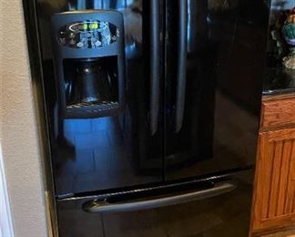 SWEET BLACK MAYTAG FRENCH DOOR REFRIGERATOR WITH BOTTOM FREEZER WATER AND ICE CRUSHED AND CUBED.