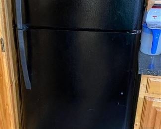 THE SECOND LIKE NEW BLACK REFRIGERATOR FREEZER. IT'S A KENMORE.