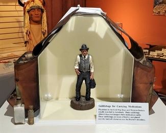 Antique Leather Physicians Saddlebag, Including Cork Topped Glass Medicine Vials And Cast Resin Statuette Of Western Doctor, 10.5" Tall