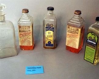 Embalming Fluids Including De-Ce-Co Dry Wash Shampoo, Duo- Raa-Co, Qty 2, Champion Cavitone Cavity Fluid, And Champion Embalming Fluid Bottle