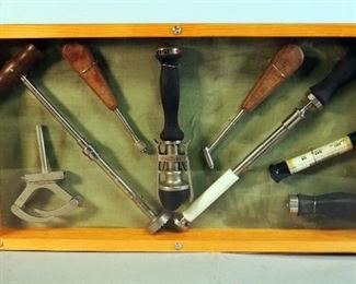 Vintage Orthopedic Surgical Tools Mounted In Wood Display Case Including Femoral Extraction Instrument, 3" x 25" x 13.5"