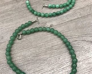 Pair of translucent green stone jadeite bead necklaces $60