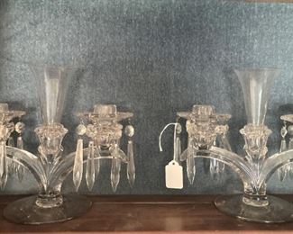 Two candle holders with vase and lusters