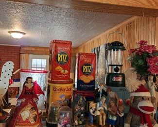 Vintage tins, stuffed monkey, family on stand, globes, Gone with the wind Scarlet, Coleman lantern