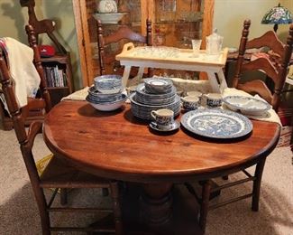 Round pedestal table with chairs