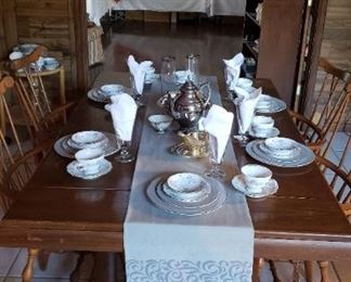 Pedestal table, vat dyed tablecloth, fine china