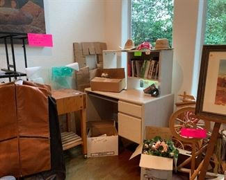 Metal & glass computer desk, butcher block, mid-century leather garment bags, computer desk with top, silk flowers, books, hats, spinning wheel and weaving items, easel, artwork