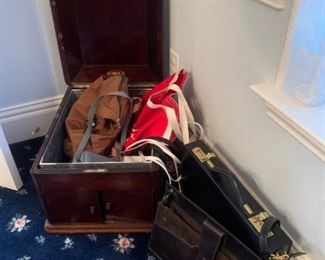 Antique Hines music box case with miscellaneous purses and briefcases