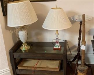 Mid-century coffee table, wood and glass display unit, porcelain lamps, stand, primitive farm implement (c. 1890)