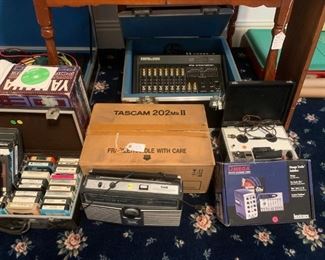 Yamaha keyboard, Tascam audio recording equipment, soundboard, 8 track cassettes and player, reel to reel recording equipment, digital audio input / recording equipment, 1935 table