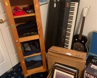 ARP Piano/synth, "dobro-style" guitar, Ensoniq soundboard, shelving unit, brand-name sweaters,  framed vintage sheet music