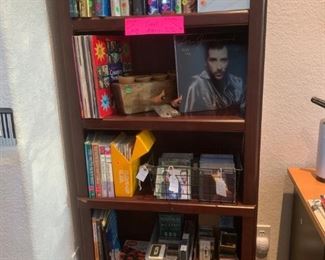 Shelving unit; first edition books; Christian and new age vinyl, CDs, cassettes, VHS; miscellaneous books; pop, new age, classical CDs and cassettes; 