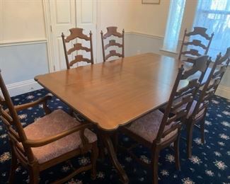 Mid-century (1965) Drexel Heritage table and six chairs with leaves and table pads; pecan wood