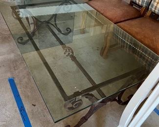 Glass and Iron Coffee Table with turned-up feet. $450