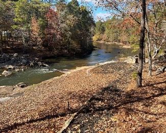 There is a BBQ pit right by the river.  What fun!  Just a string of lights in the trees is all that is needed here.  There is a wall of sloping granite down to the river.  The noise is naturally soothing.
