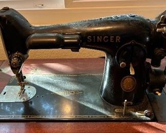 Old singer sewing machine with table