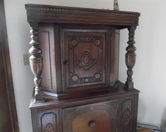 Hand carved, and stained wooden cabinet