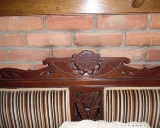 Just look at that hand carved detailing on this antique loveseat