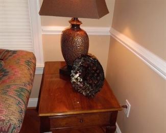 Beautiful and solid wood end table, decorative artwork and an amazing lamp