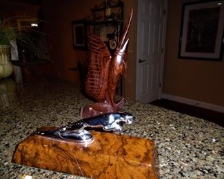Spectacular hand-carved swordfish, and exquisite Jaguar hood ornament mounted on Tiger Maple