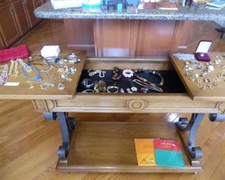 We have a nice small collection of jewelry, jewelry display table, we are sorry is not for sale