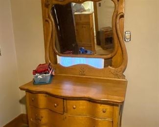 Antique serpentine front dresser with mirror 